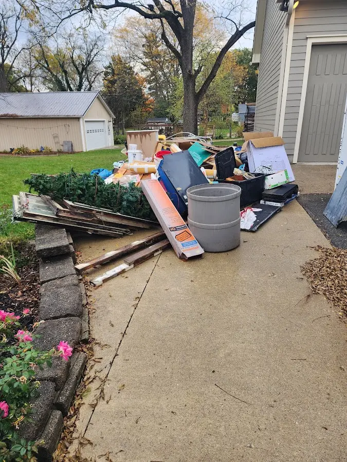 Dumpster being loaded with debris for Roofing Dumpster Rental in West Hanover